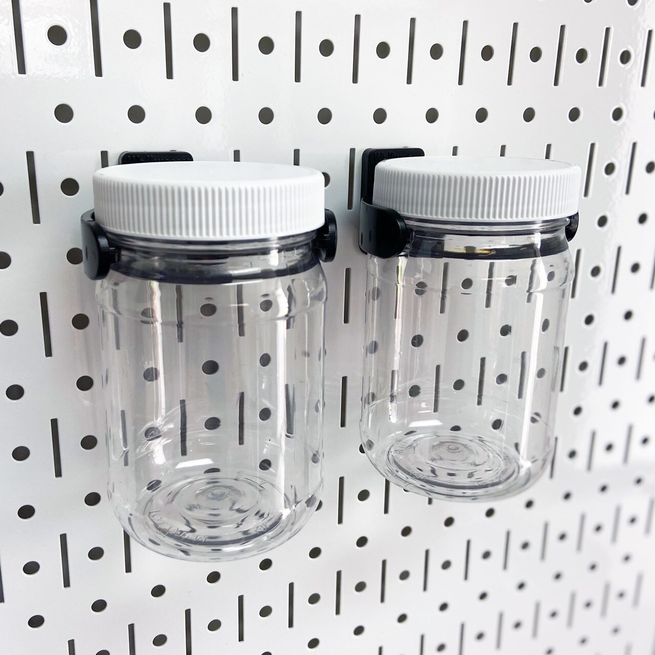 Pegboard jars, storage and organization system includes 2 plastic jars, also holds standard mason jars