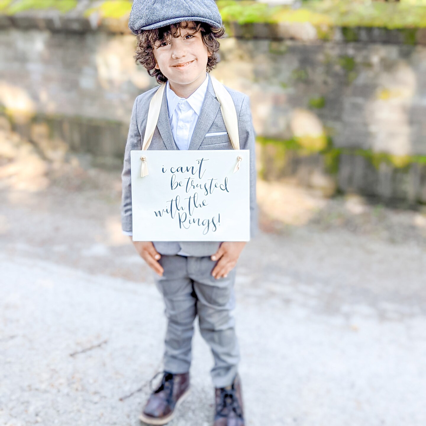 Ritzy Rose Funny Ring Bearer Sign - Black on 11x8in Ivory Linen Cardstock with champagne Ribbon