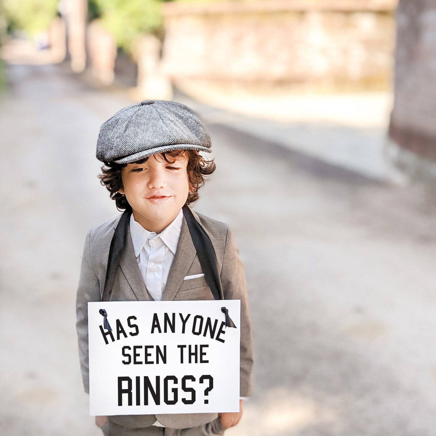 Ritzy Rose 2 Funny Ring Bearer Sign - Black on 11x8in White Linen Cardstock with Black Ribbon