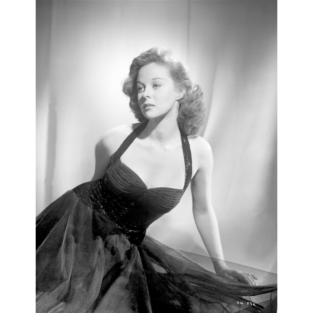 Posterazzi Susan Hayward sitting in a Black Halter Dress Photo Print