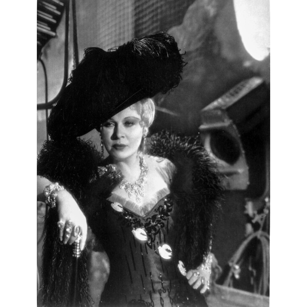 Posterazzi Mae West Leaning in Black Dress with Black Hat Photo Print