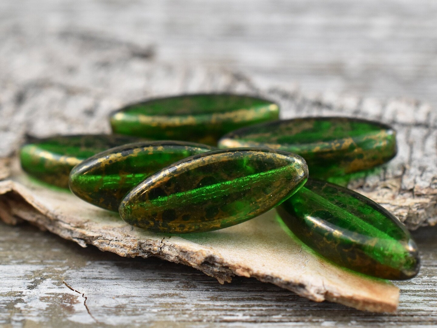 *10* 18x7mm Gold Washed Emerald Green Spindle Beads