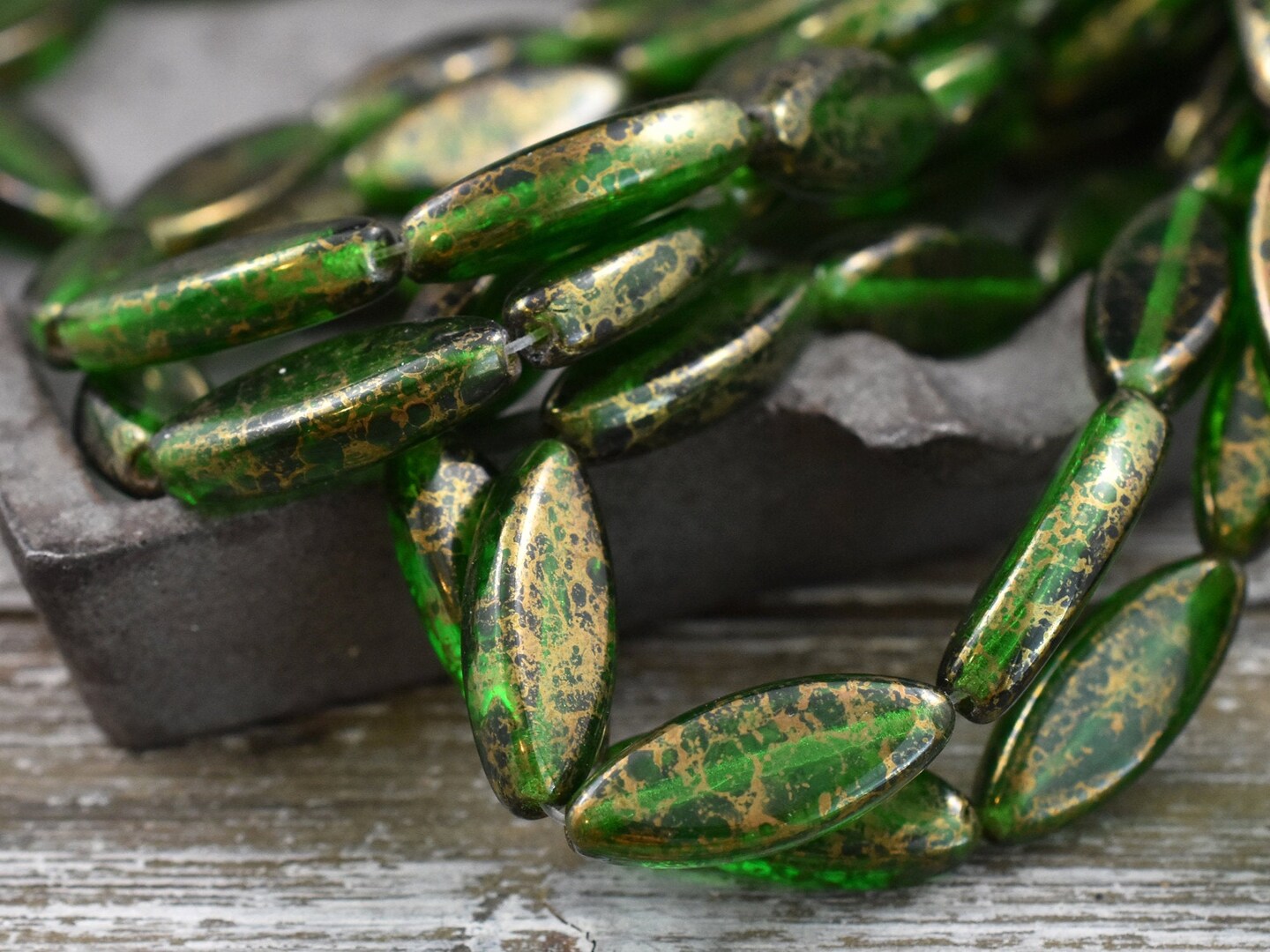 *10* 18x7mm Gold Washed Emerald Green Spindle Beads