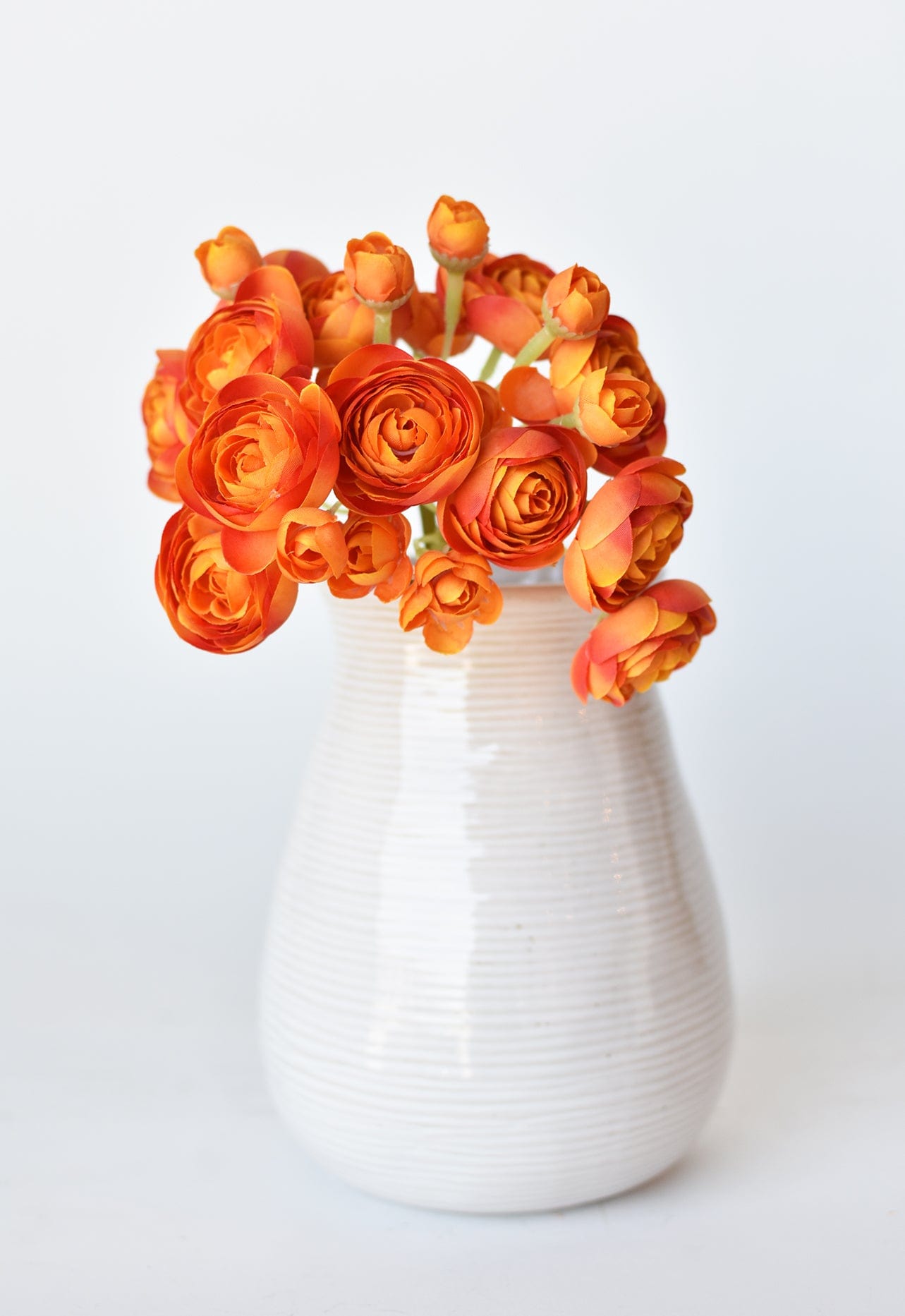 10.5&#x22; Faux Peachy Orange Ranunculus Stem Bundle