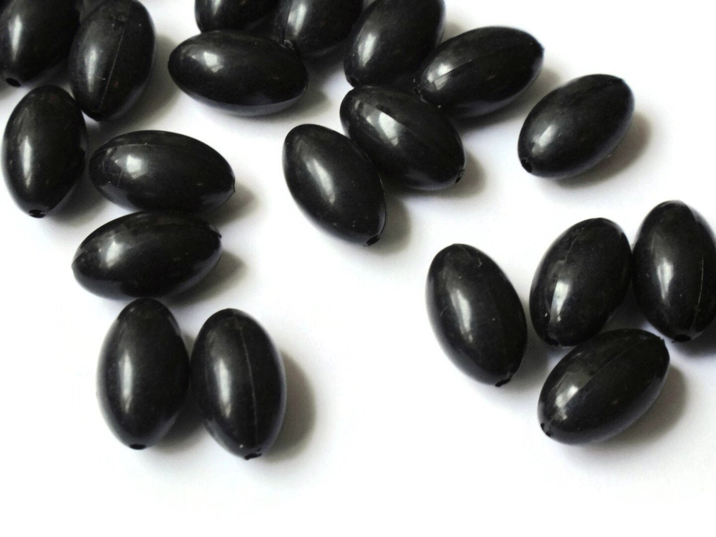 50 12mm x 7mm Smooth Oval Black Plastic Beads