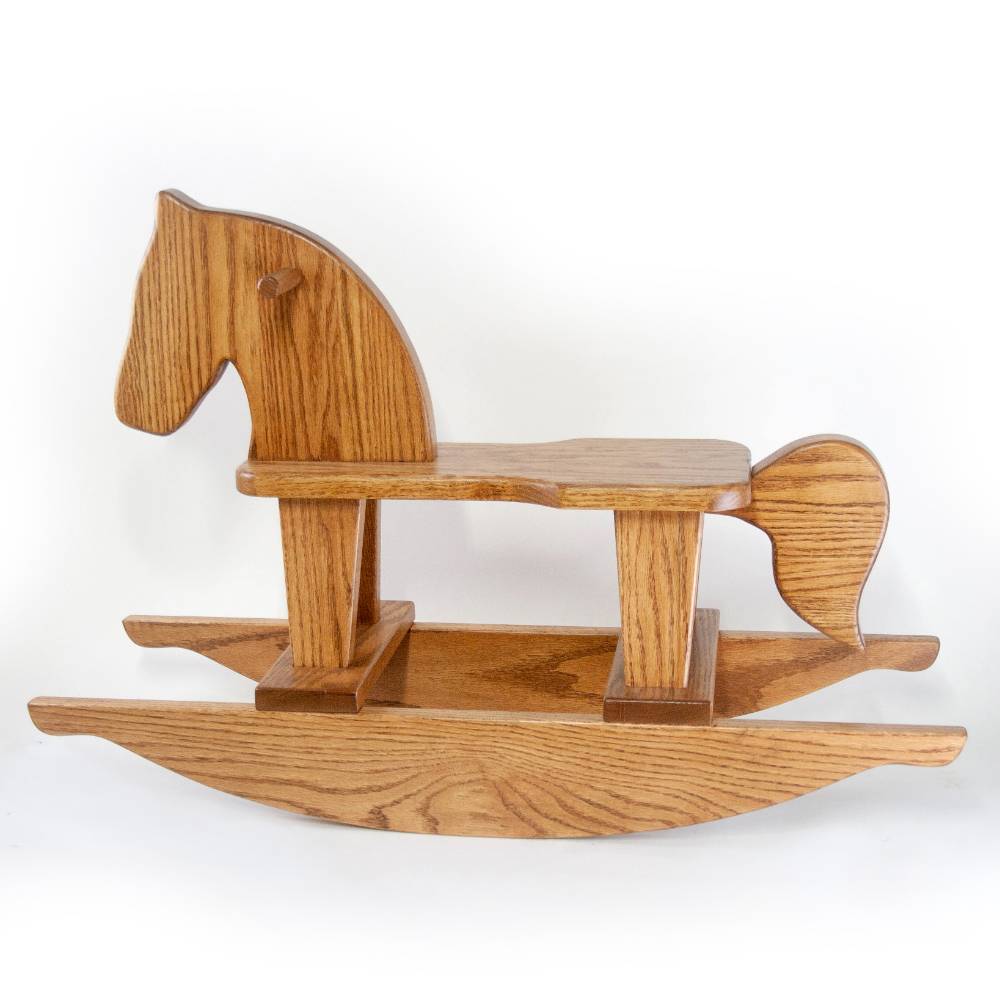 Child on rocking horse on sale