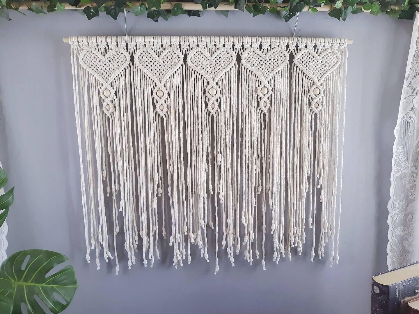 product name is Macrame Wedding Backdrop, Headboard or Wall Hanging with Intricate Heart Design and Wood Beads, Personalized Style