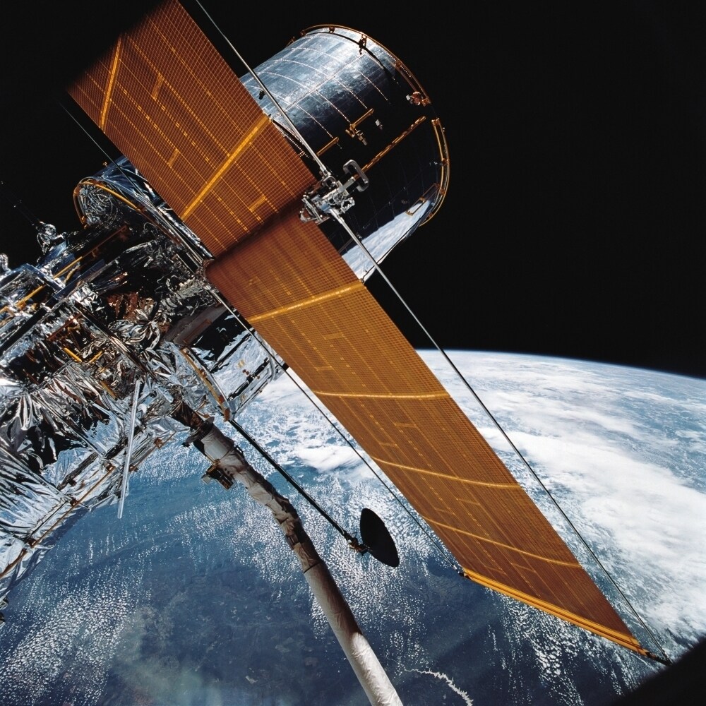 The Hubble Space Telescope Backdropped By Planet Earth Poster Print
