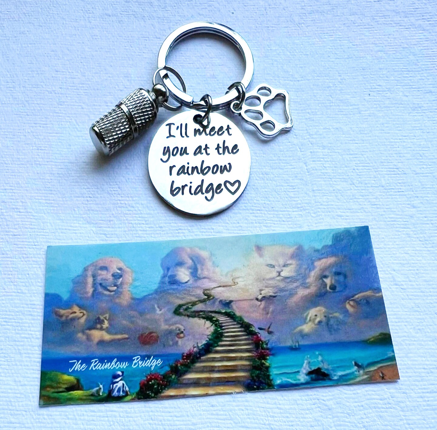 product name is Faceted Steel "Rainbow Bridge" CREMATION URN Keepsake Keychain (as shown)  Includes Velvet Pouch and Fill Kit