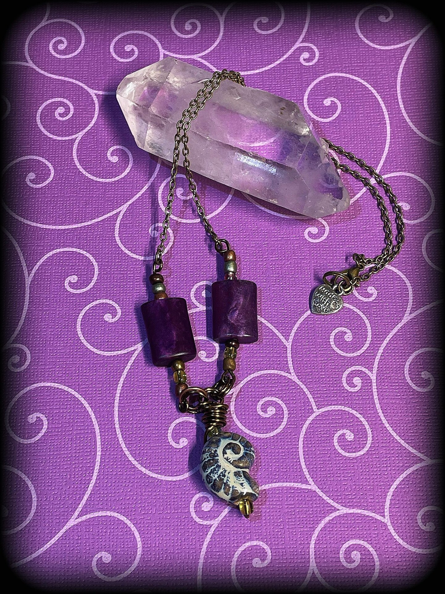 Faux Fossil Shell Necklace on antique wire with purple sparkle beads MakerPlace by Michaels