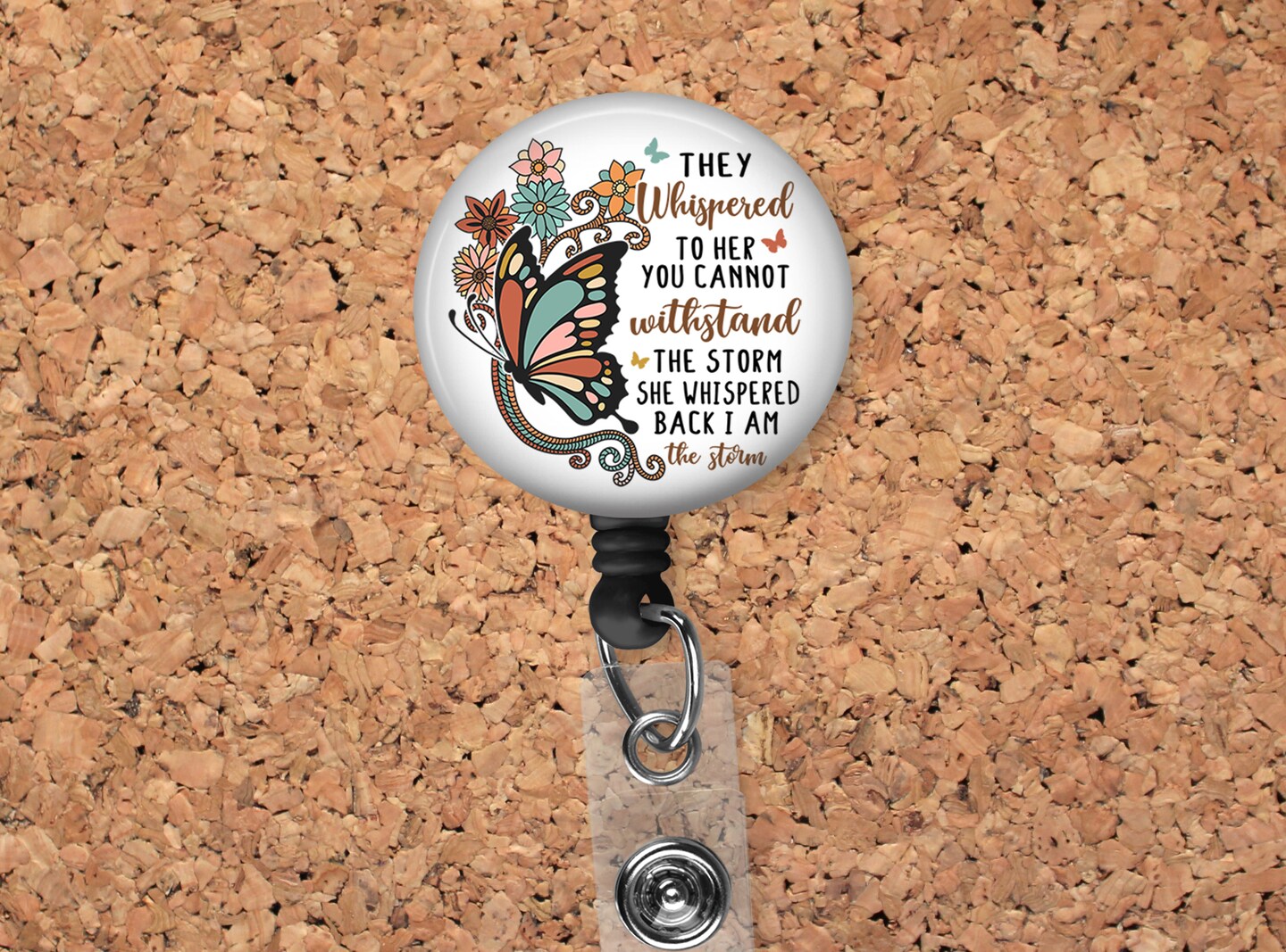 I am the Storm Badge Reel ID Holder featuring a beautiful butterfly