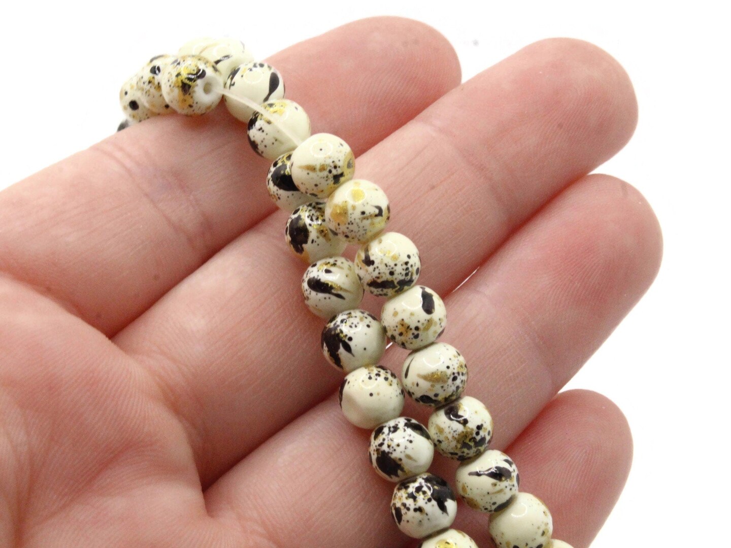 68 6mm Ivory, Gold and Black Splatter Paint Smooth Round Glass Beads