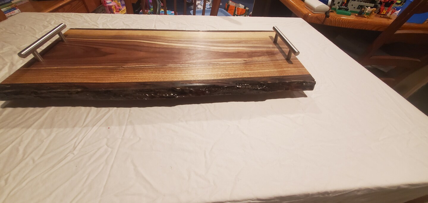 Live edge walnut and epoxy serving popular board