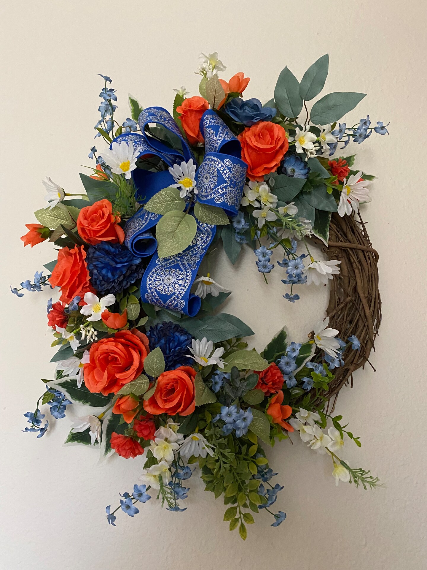 Beautiful cypress and fern greenery Christmas wreath with bells in