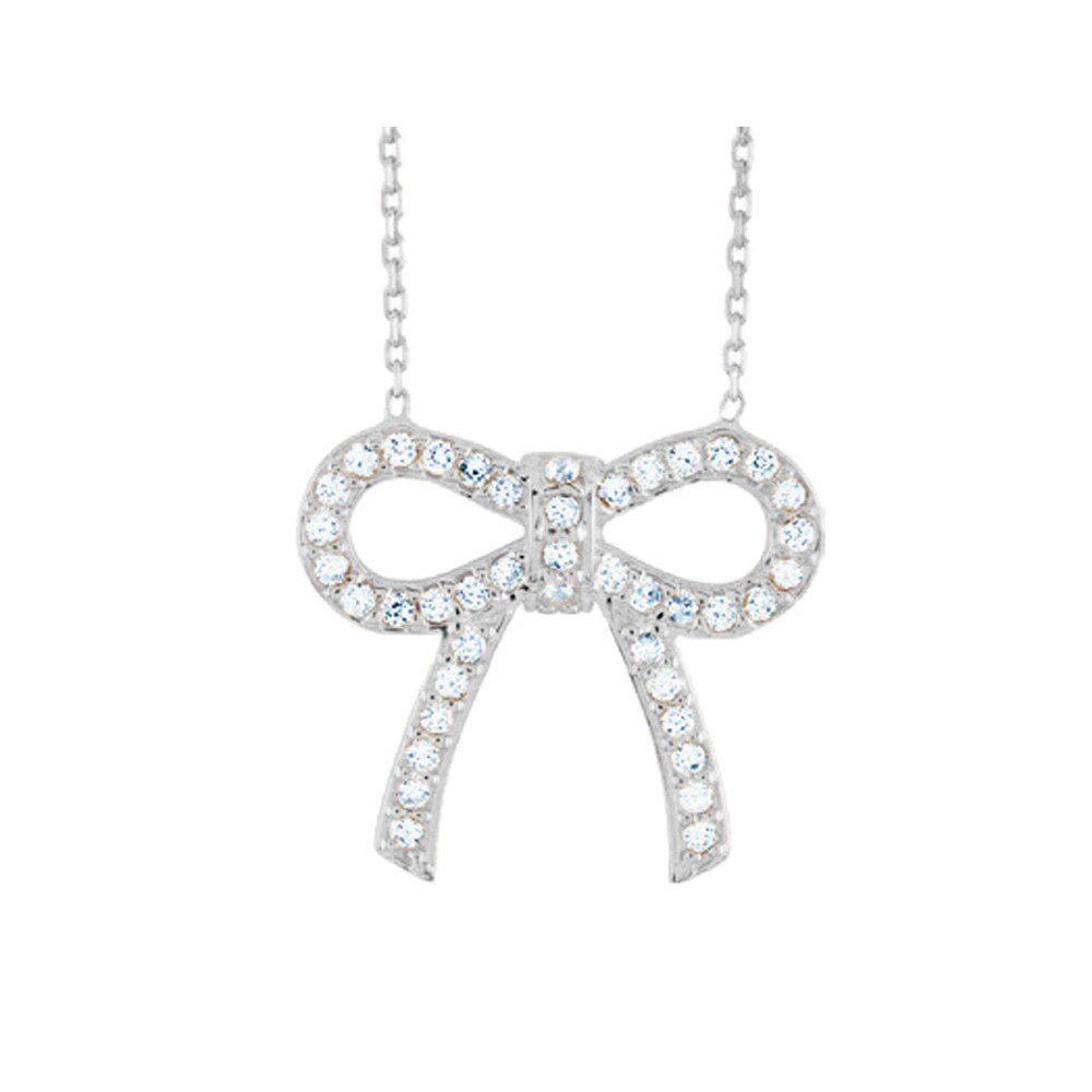 Gem And Harmony Synthetic Crystal Bow Pendant Necklace in Sterling Silver