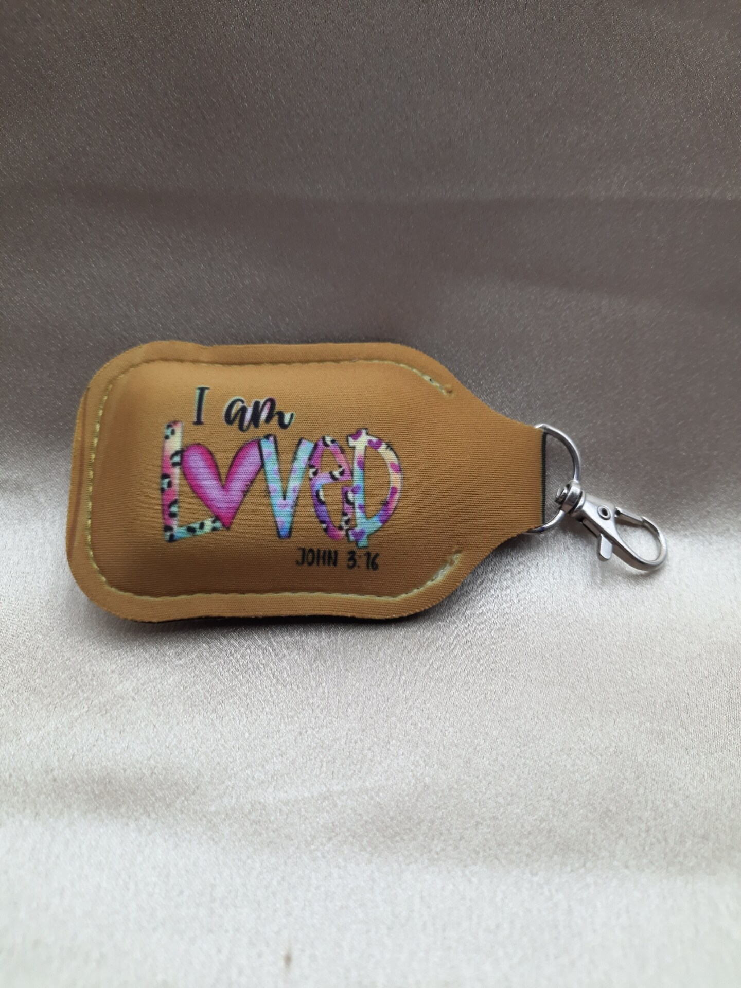 Clip on, flip top hand sanitizer, lotion holder MakerPlace by Michaels