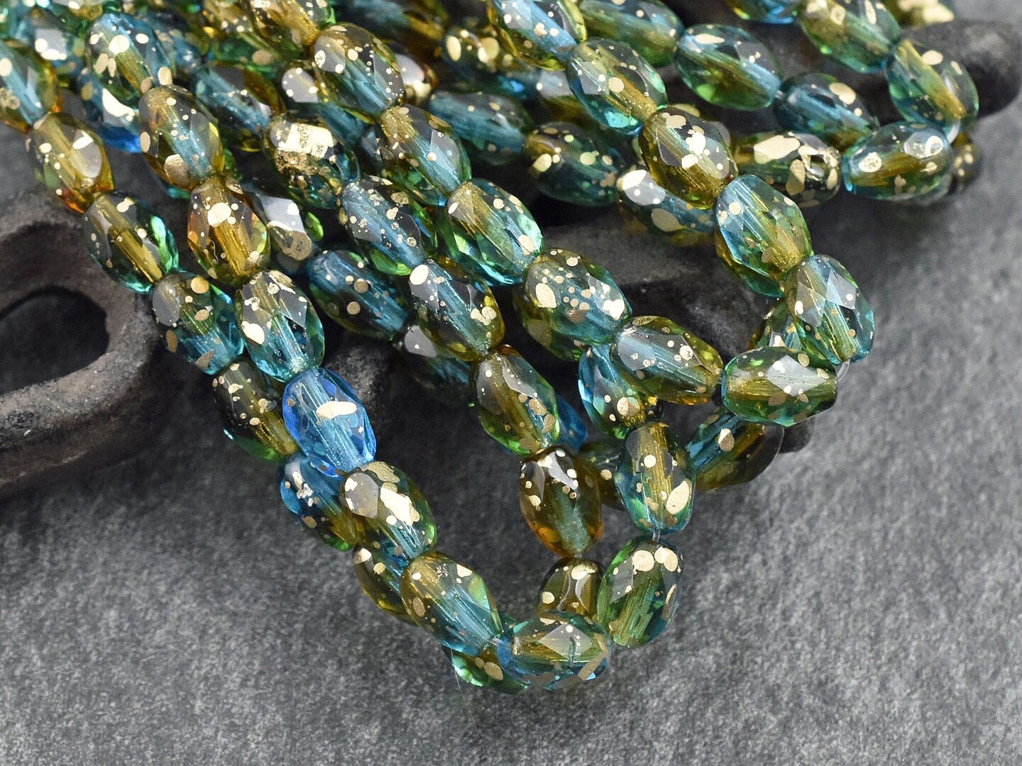 *20* 5x7mm Gold Washed Teal Topaz Fire Polished Faceted Oval Beads