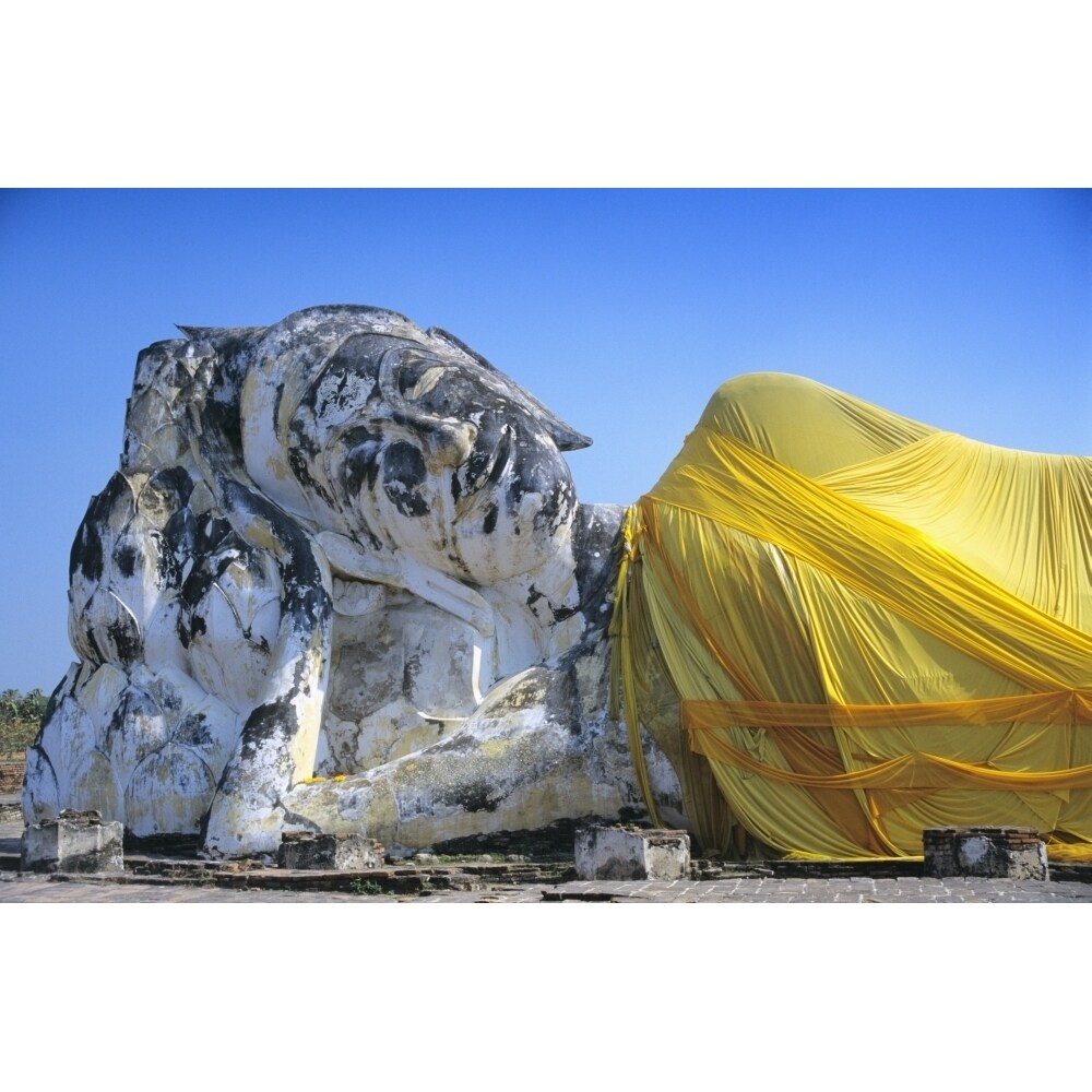 Posterazzi Reclining Budda statue wrapped with yellow cloth Poster Print