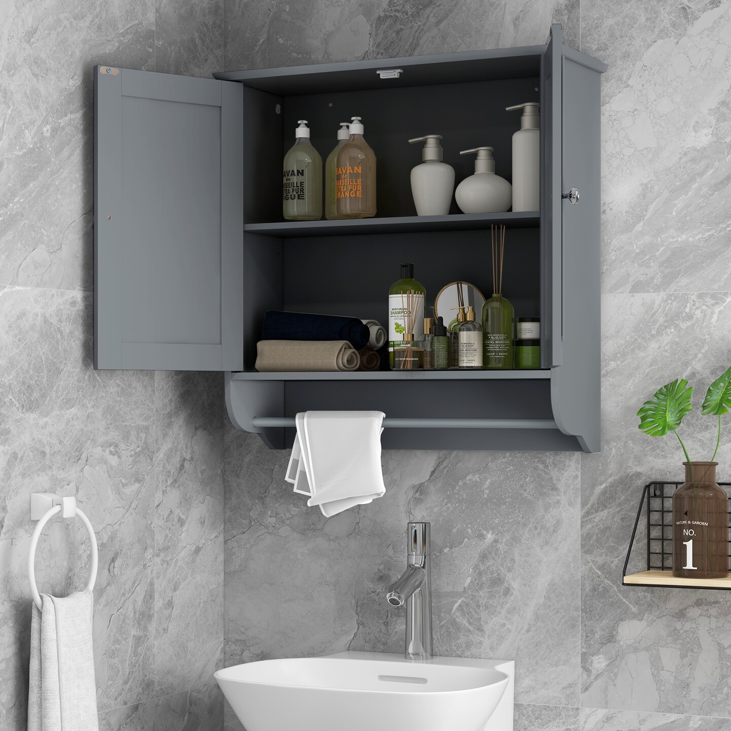 White medicine cabinet store with towel bar