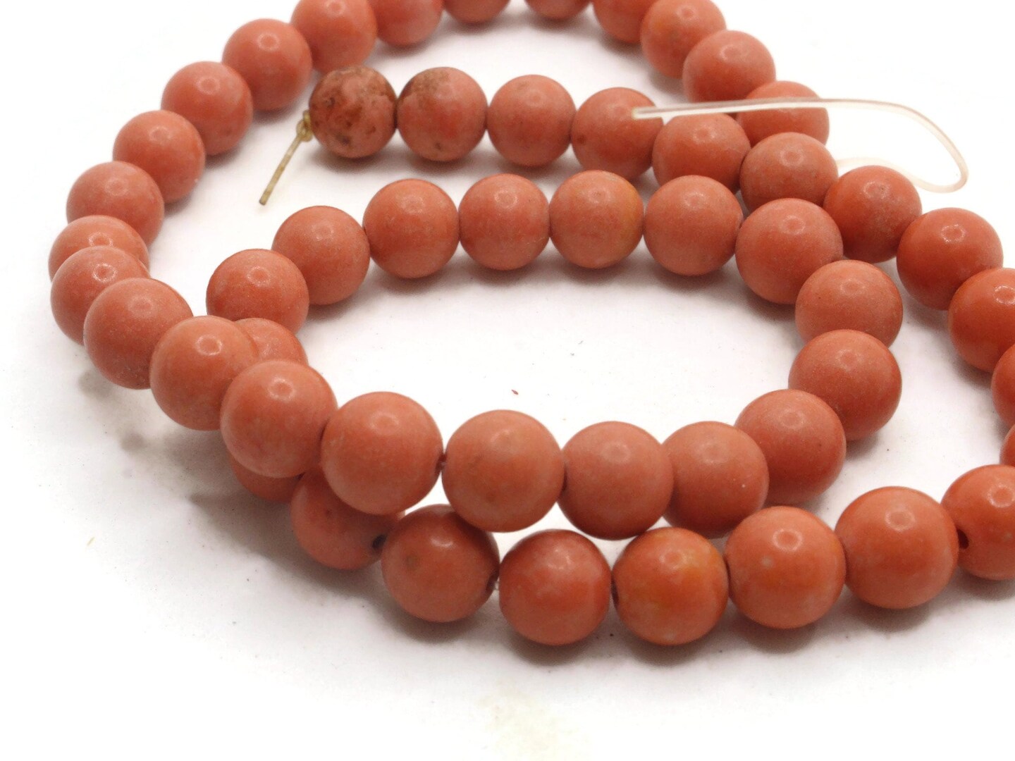 51 7mm to 8mm Round Dyed Orange Howlite Stone Beads