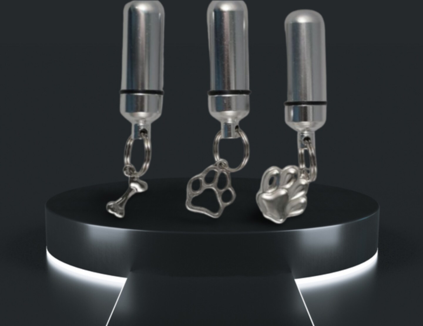 product name is Set of THREE Silver Dog Bone and Dog Paws CREMATION URN Necklaces on 24" Steel Ball Chains - Includes Velvet Pouches and Fill Kit