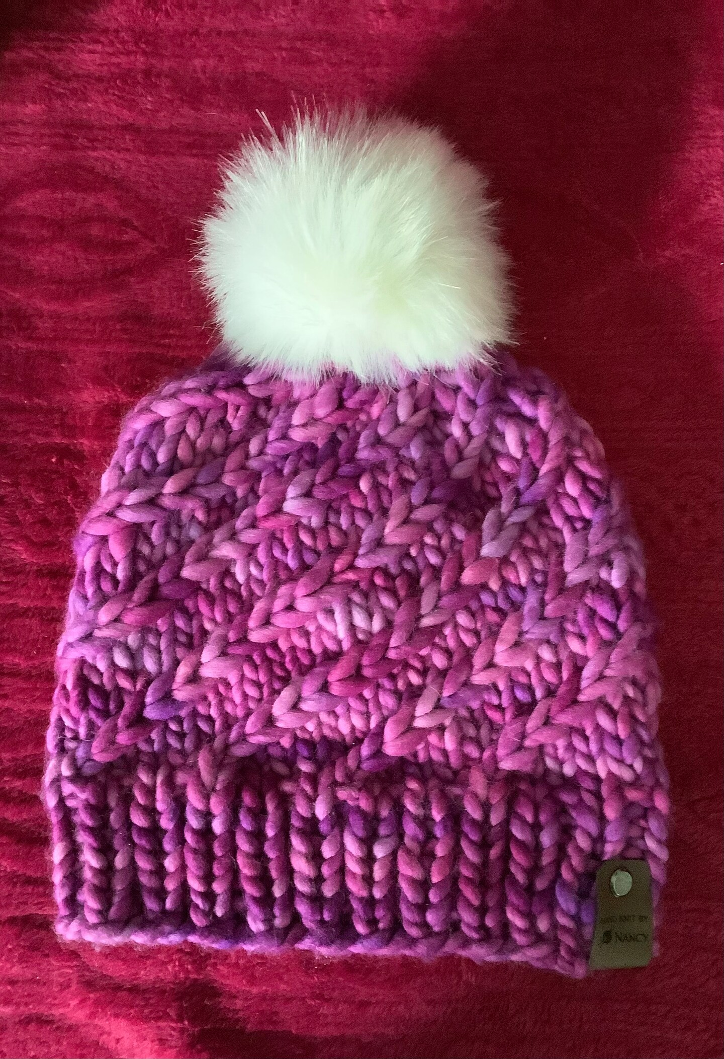 Hand knitted Chunky weight hat with faux Pom Pom made with