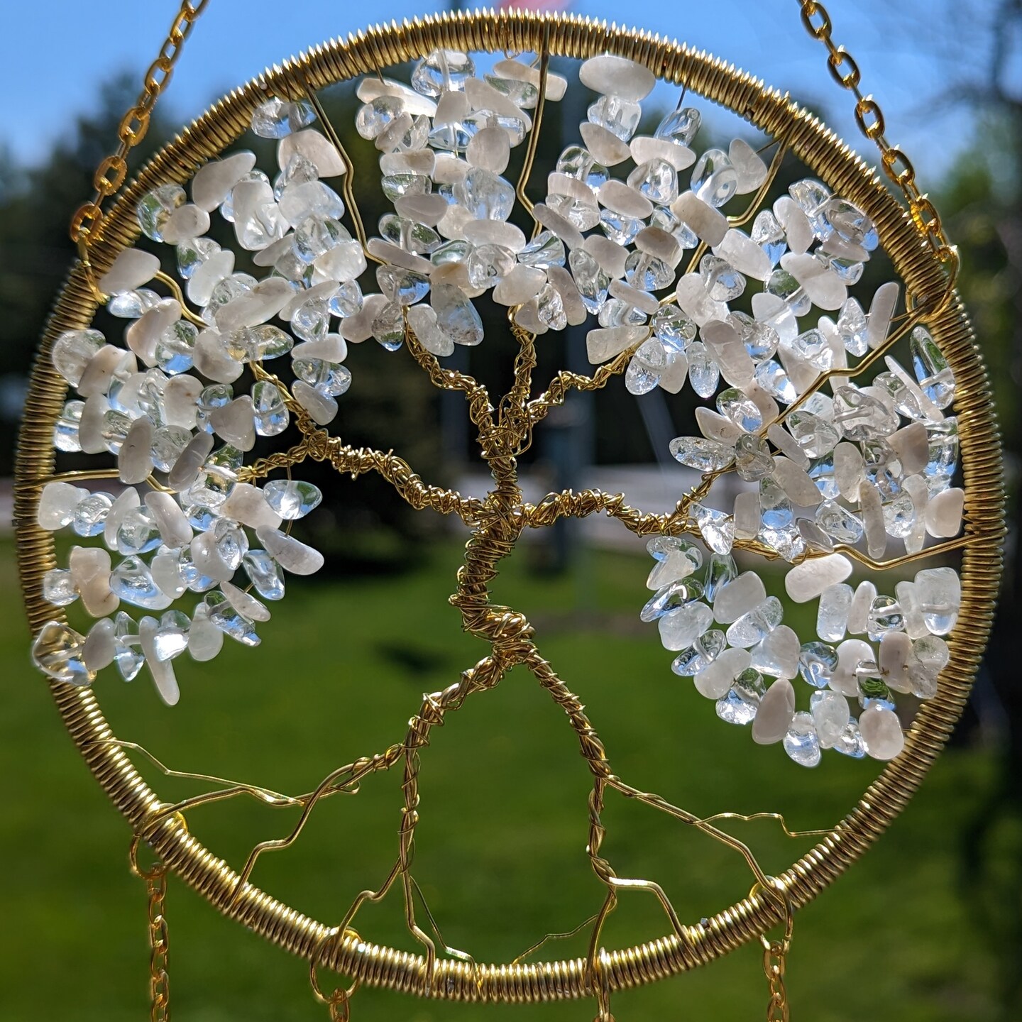 product name is Moonstone Crystal June Birthstone Tree of Life Sun Catcher- Gemini, Cancer, Handmade, Light Catcher, Window Ornament