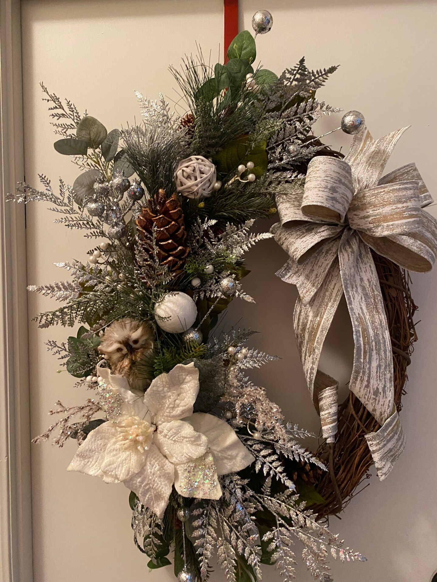 Beautiful cypress and fern greenery Christmas wreath with bells in