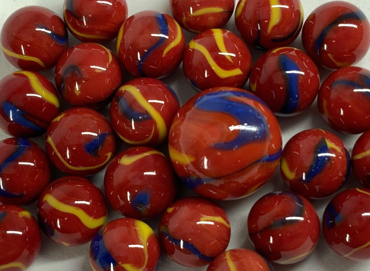 25 Marbles SCARLET MACAW Red Blue Stripes Yellow Glass game pack Shooter