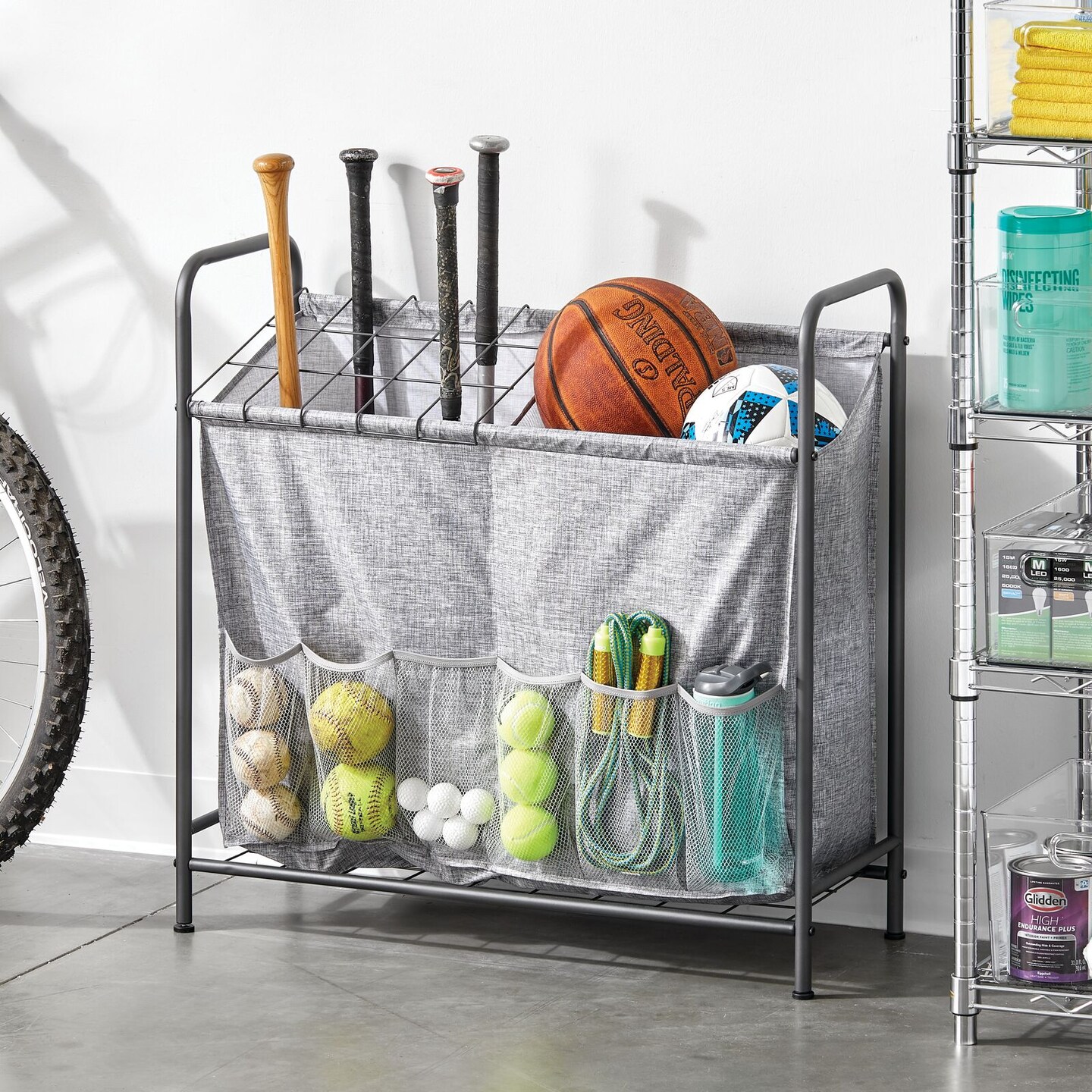 mDesign Sports Equipment Storage Organizer Bin Rack with Front Pockets