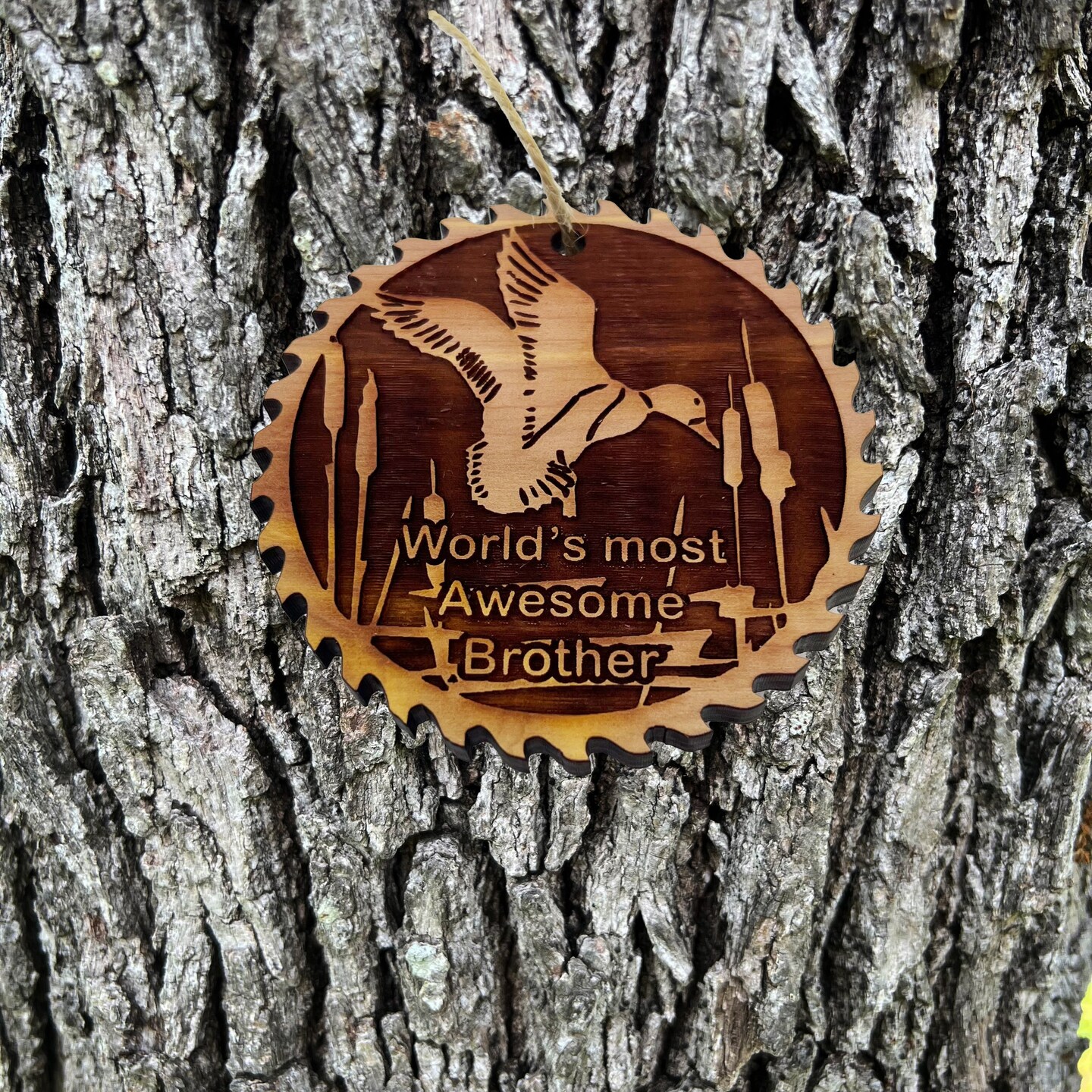 Sawblade with Duck Worlds Most Awesome Brother - Cedar Ornament Sawblade with Duck Worlds Most Awesome Brother - Cedar Ornament