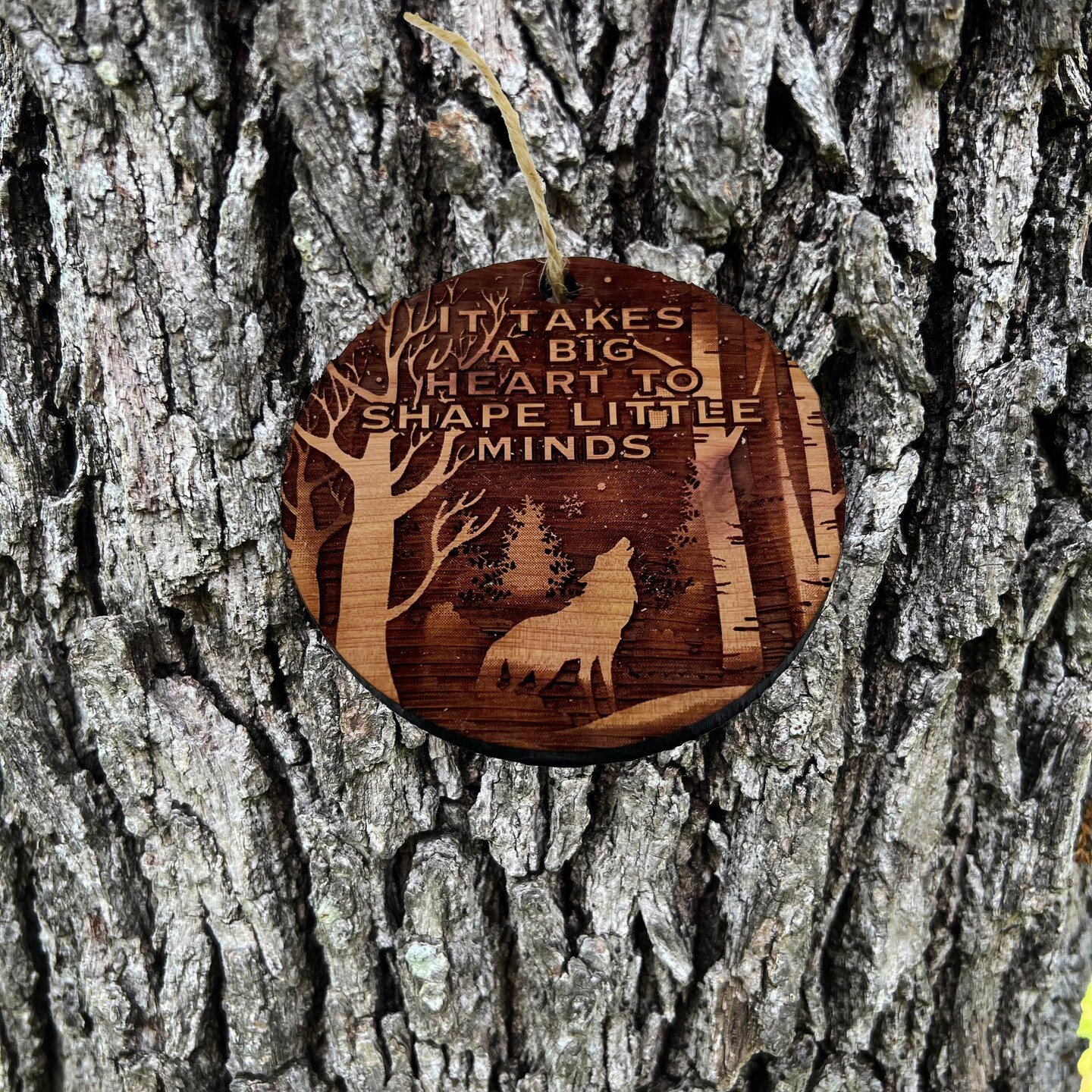 Winter Wolf it takes a big heart to shape little minds - cedar ornament Winter Wolf it takes a big heart to shape little minds - cedar ornament