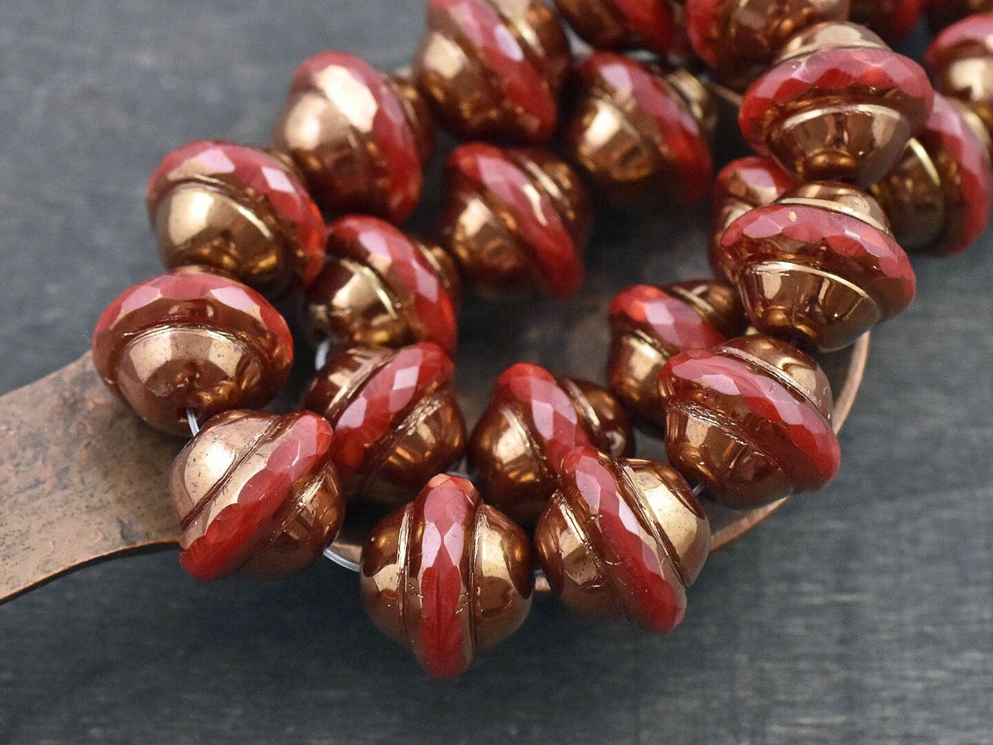 10x12mm Bronze Washed Ruby Red Saturn Beads