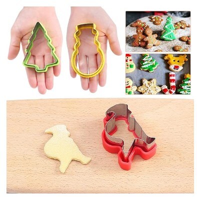 Christmas Cookie Cutters: 9 Christmas holiday themed baking cutters in the shapes of a flying deer, a snowflake, a Christmas tree, a deer head, Santa Claus, socks, crutches, a snowman, and a gingerbread man.