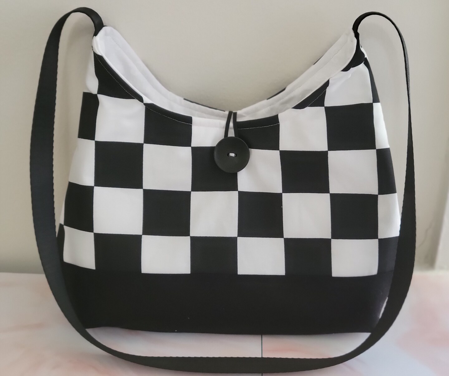 White and cheap grey checkered purse