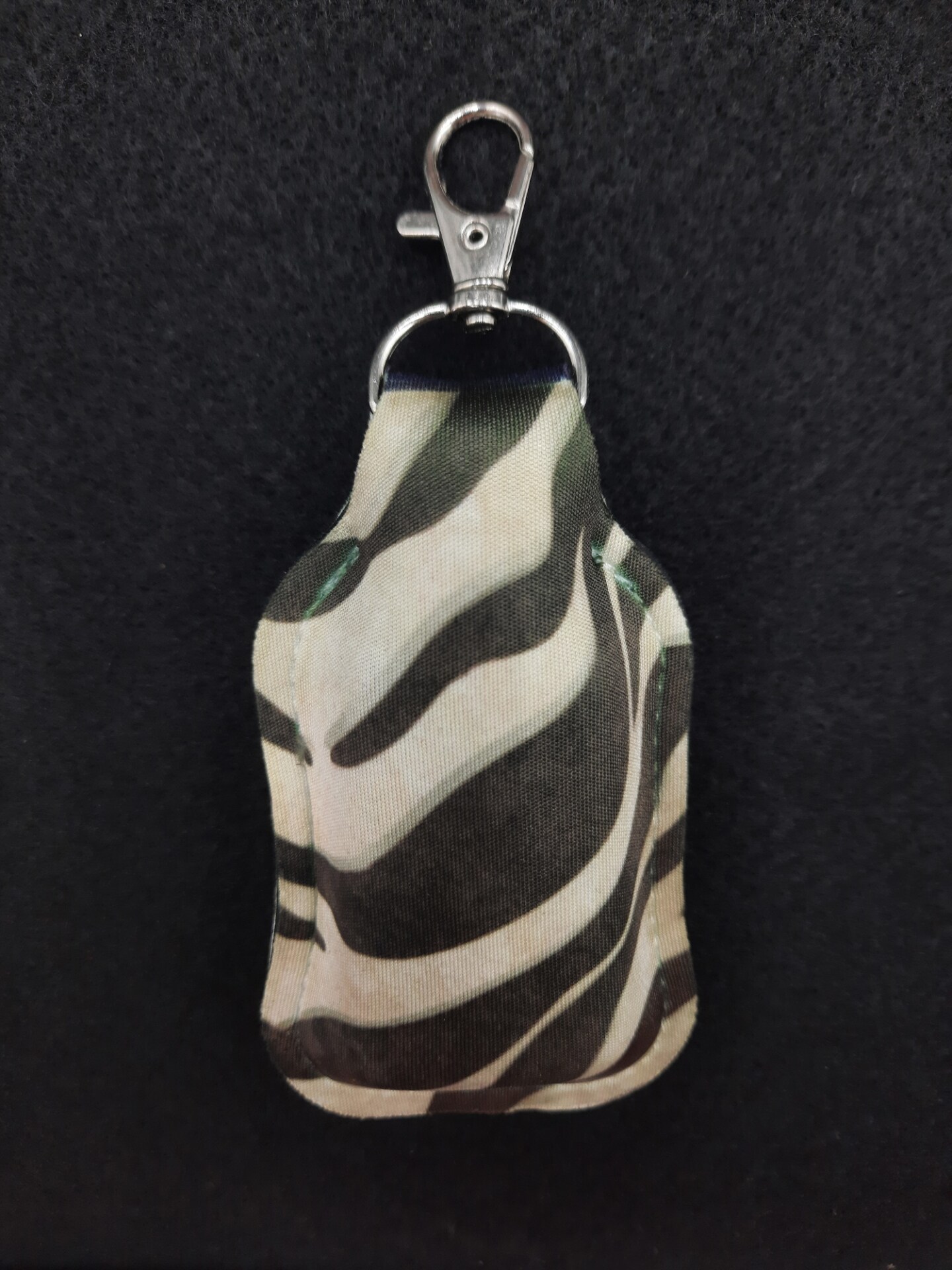 Clip on, flip top hand sanitizer, lotion holder MakerPlace by Michaels