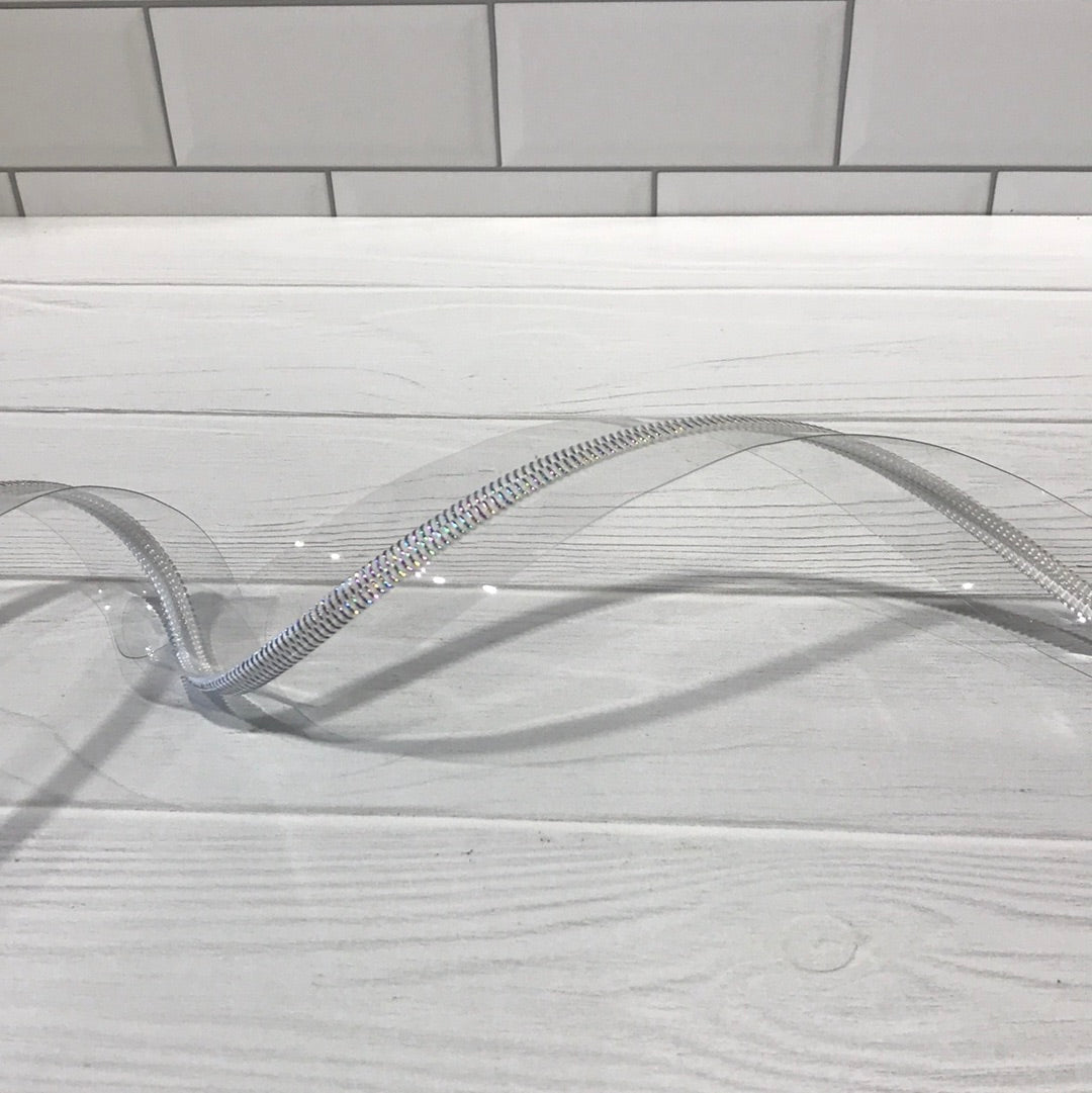 Clear vinyl zipper tape with white iridescent teeth