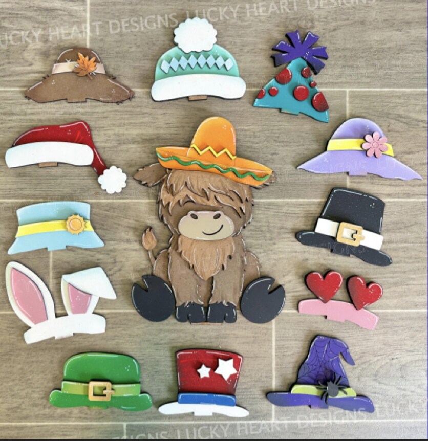 product name is Highland cow with interchangeable hats