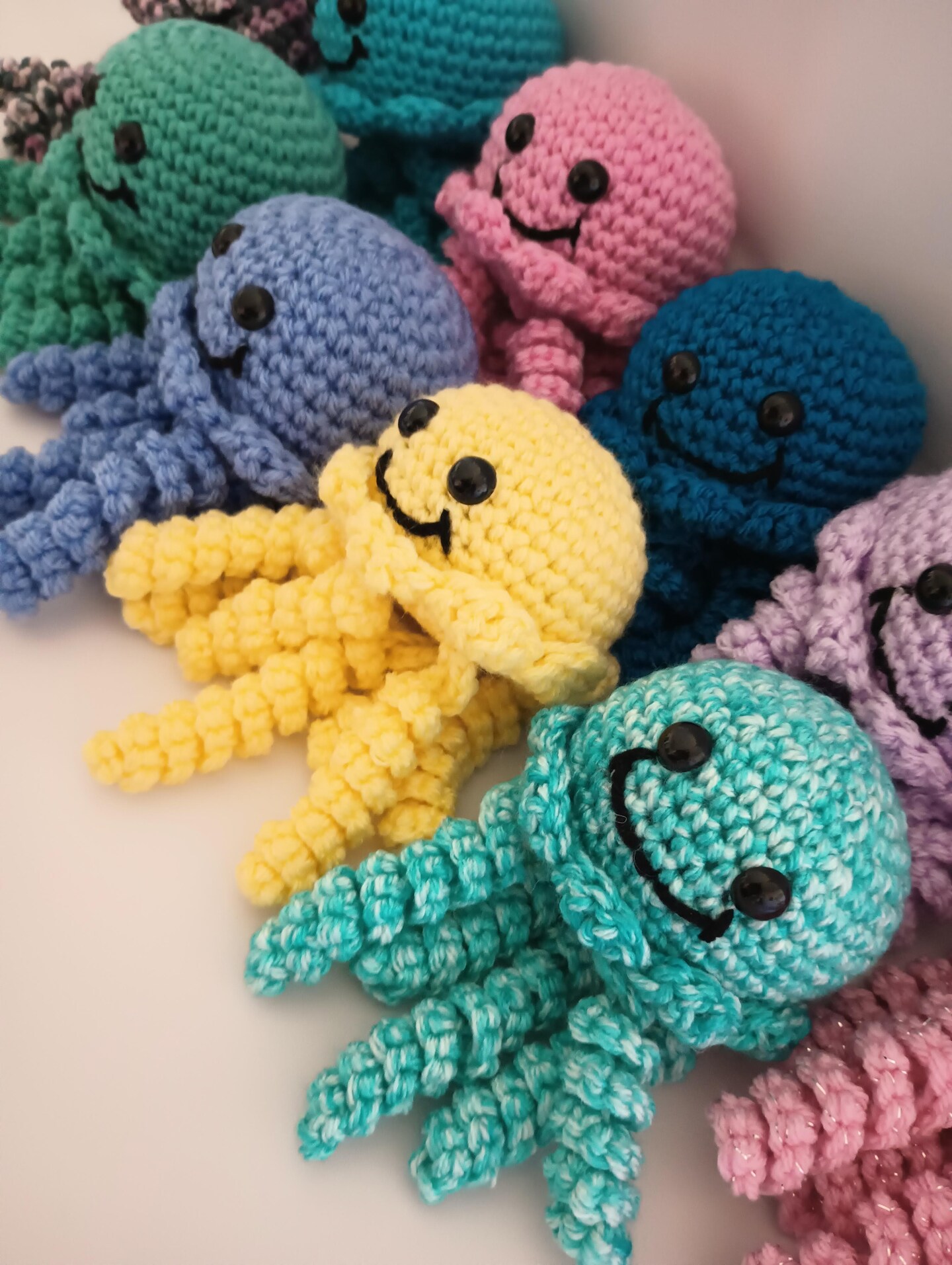 product name is Handmade Crochet Jellyfish. Made with Acrylic Yarn and Safety Eyes Securely Attached.   Choose Jellyfish with or without Santa Hat.