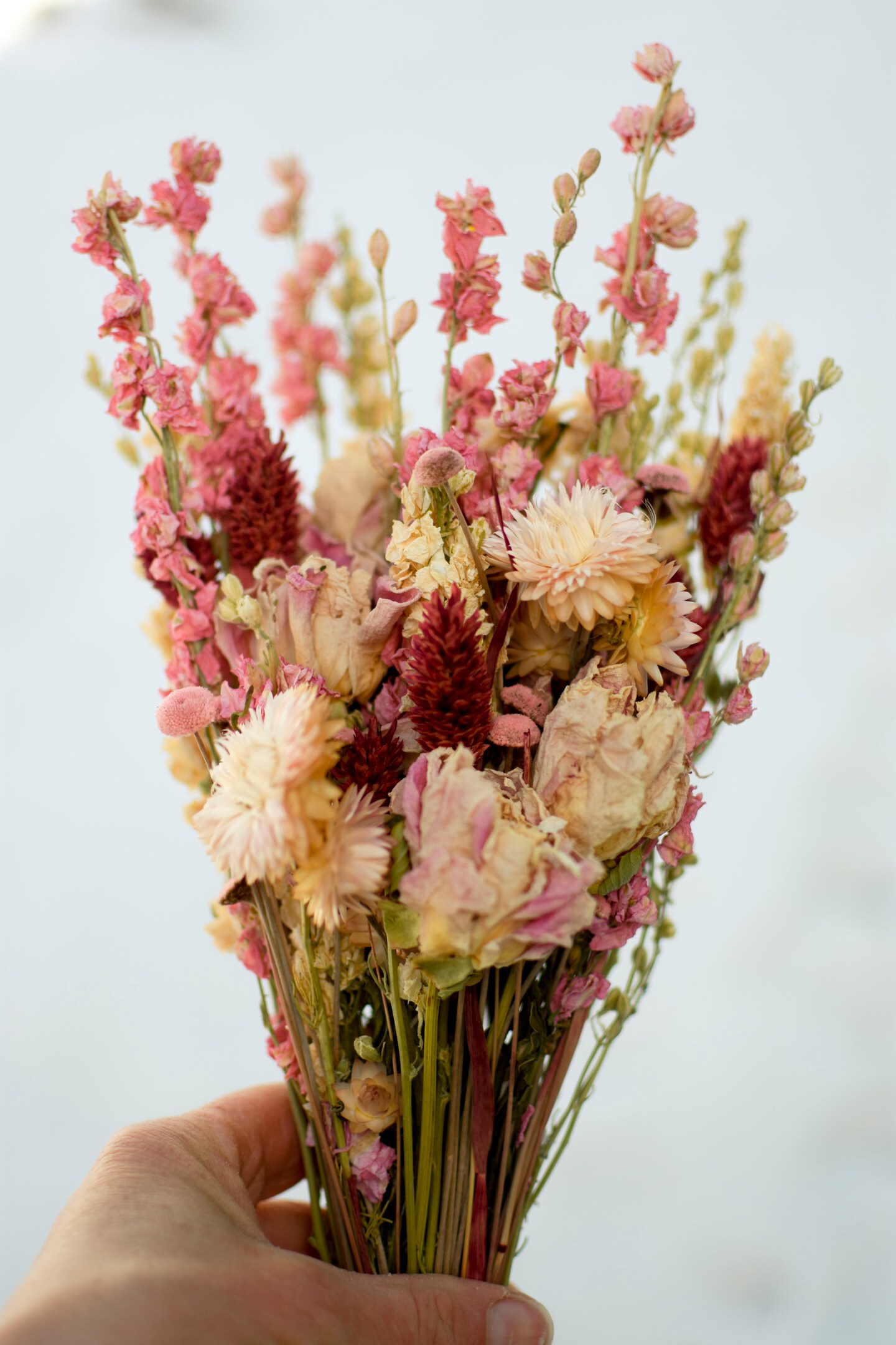 Pink and cream wildflower bouquet with peonies