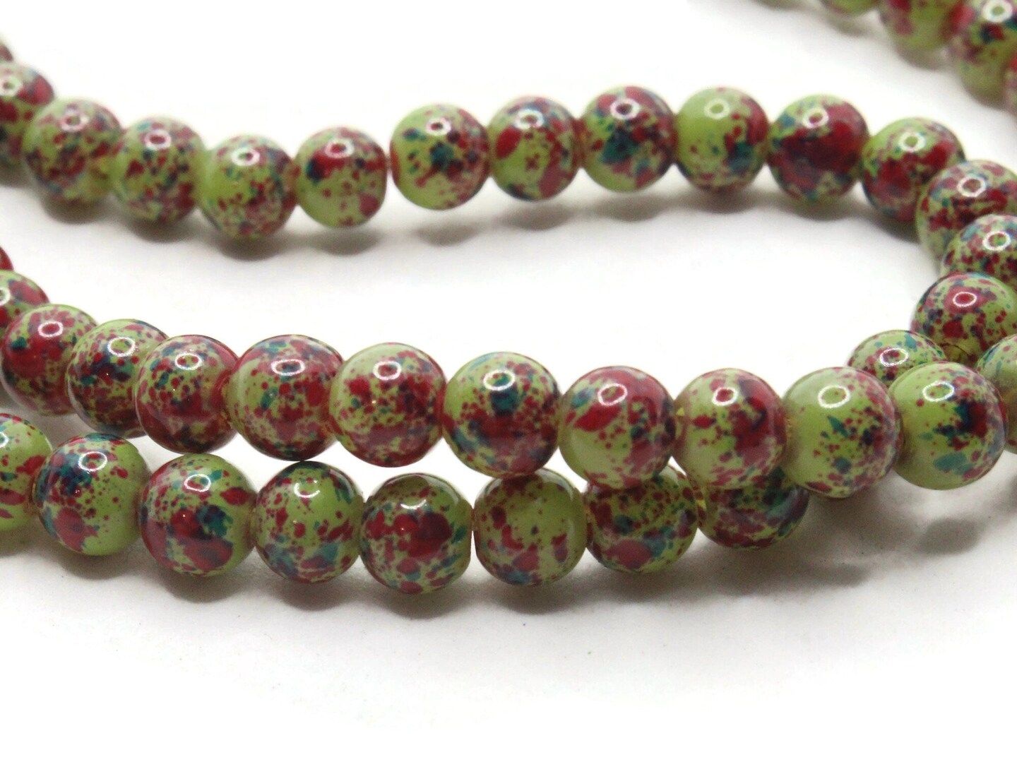75 6mm Green and Red Splatter Paint Smooth Round Glass Beads