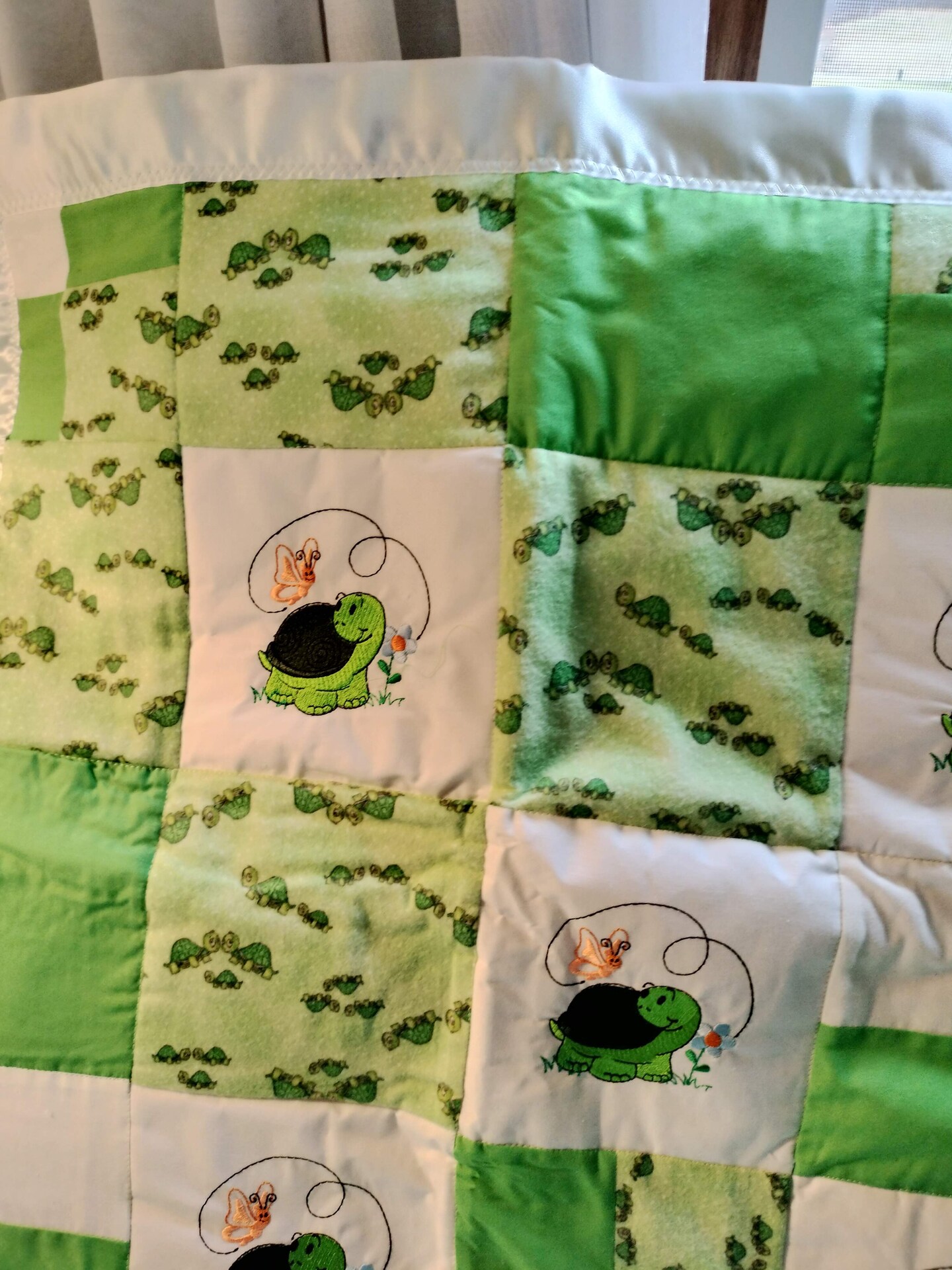 a-crib-quilt-with-co-ordinating-pillow-and-lots-of-turtles-makerplace