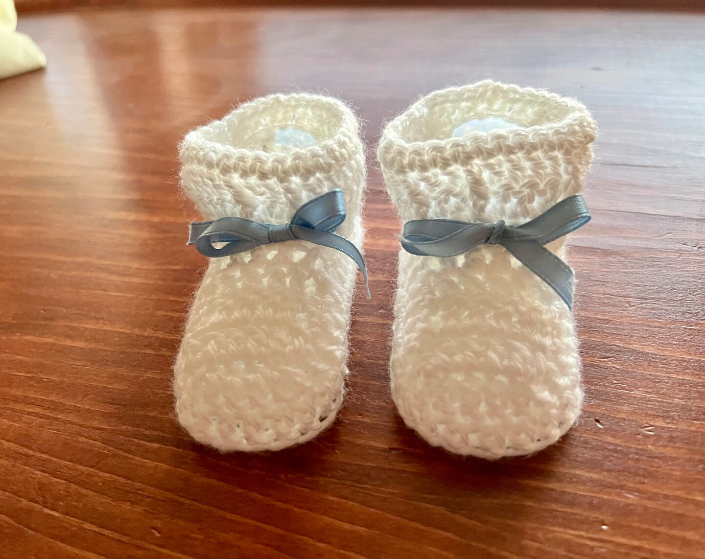 White crochet baby booties MakerPlace by Michaels