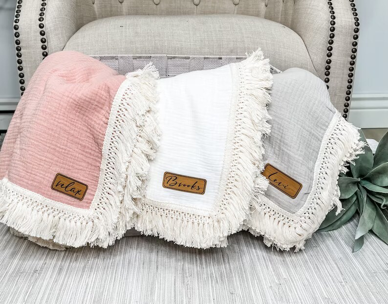 product name is Fringe Muslin Baby Blanket