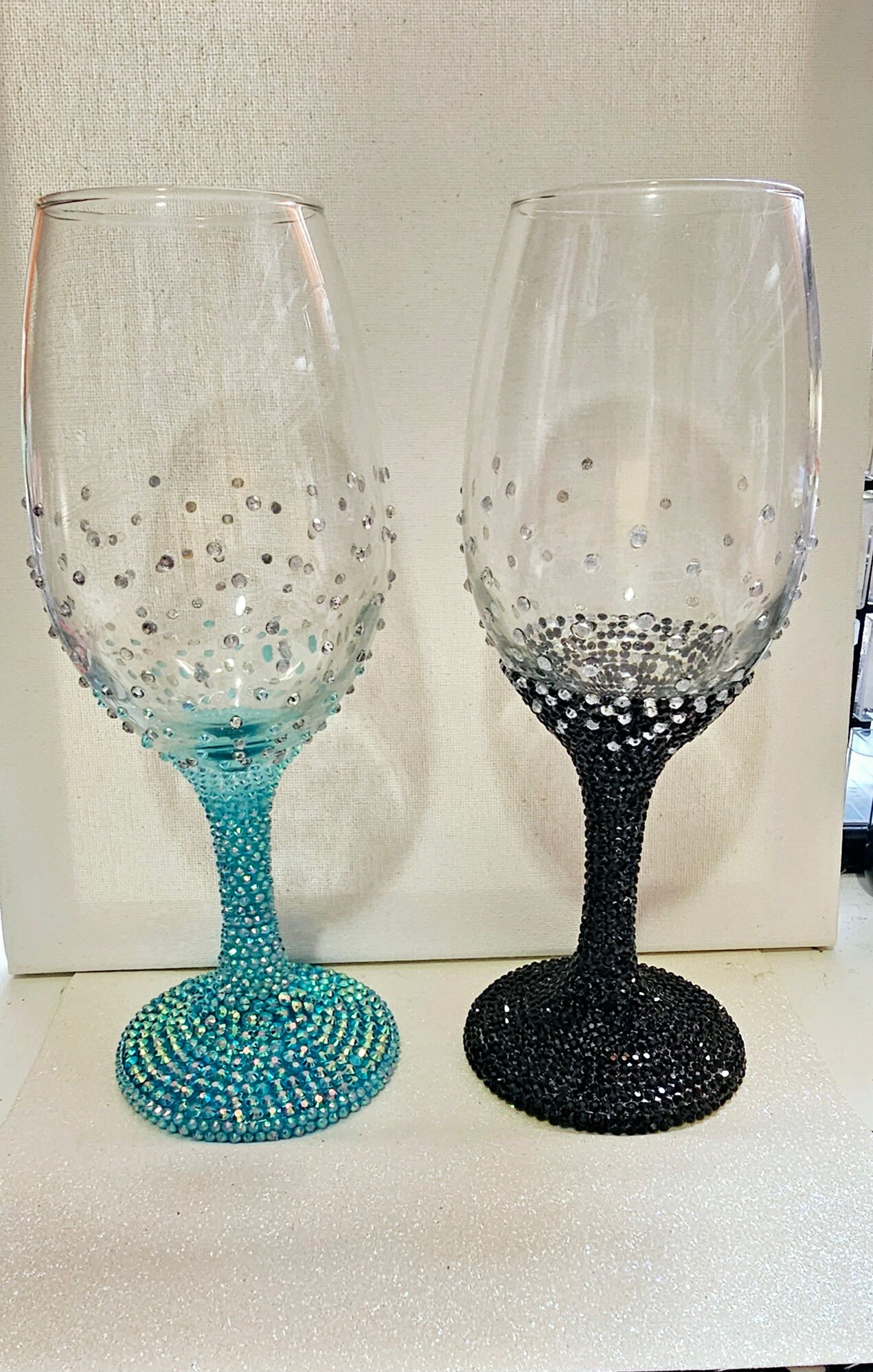 Champagne flutes or wine glasses encrusted with rhinestones