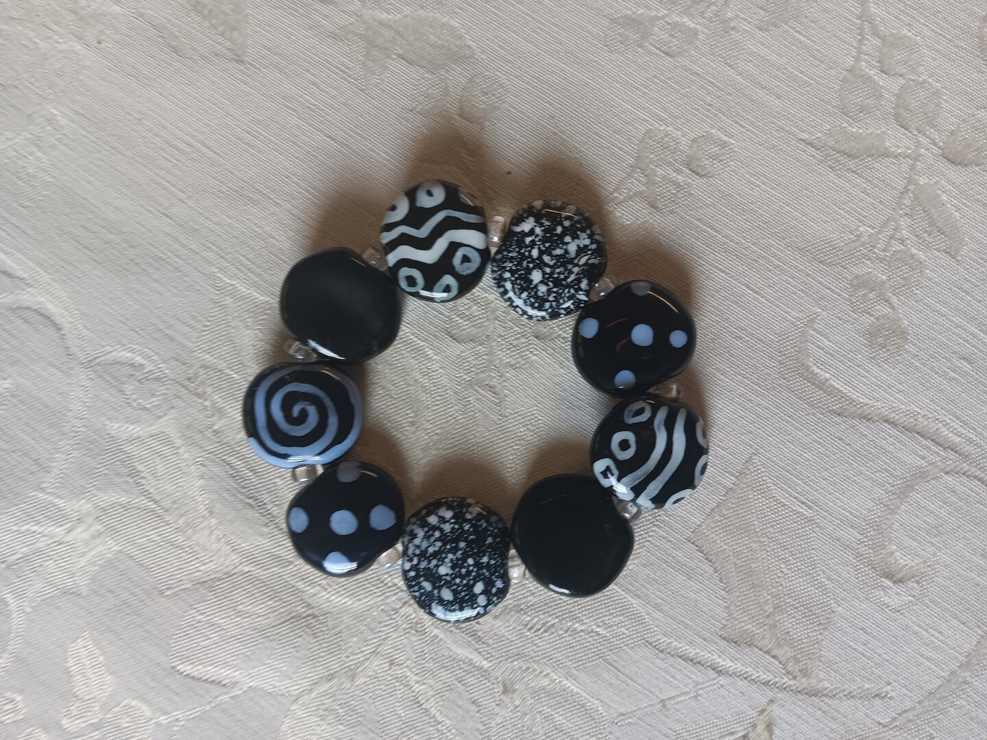 Clear bracelet with clearance black and white bead