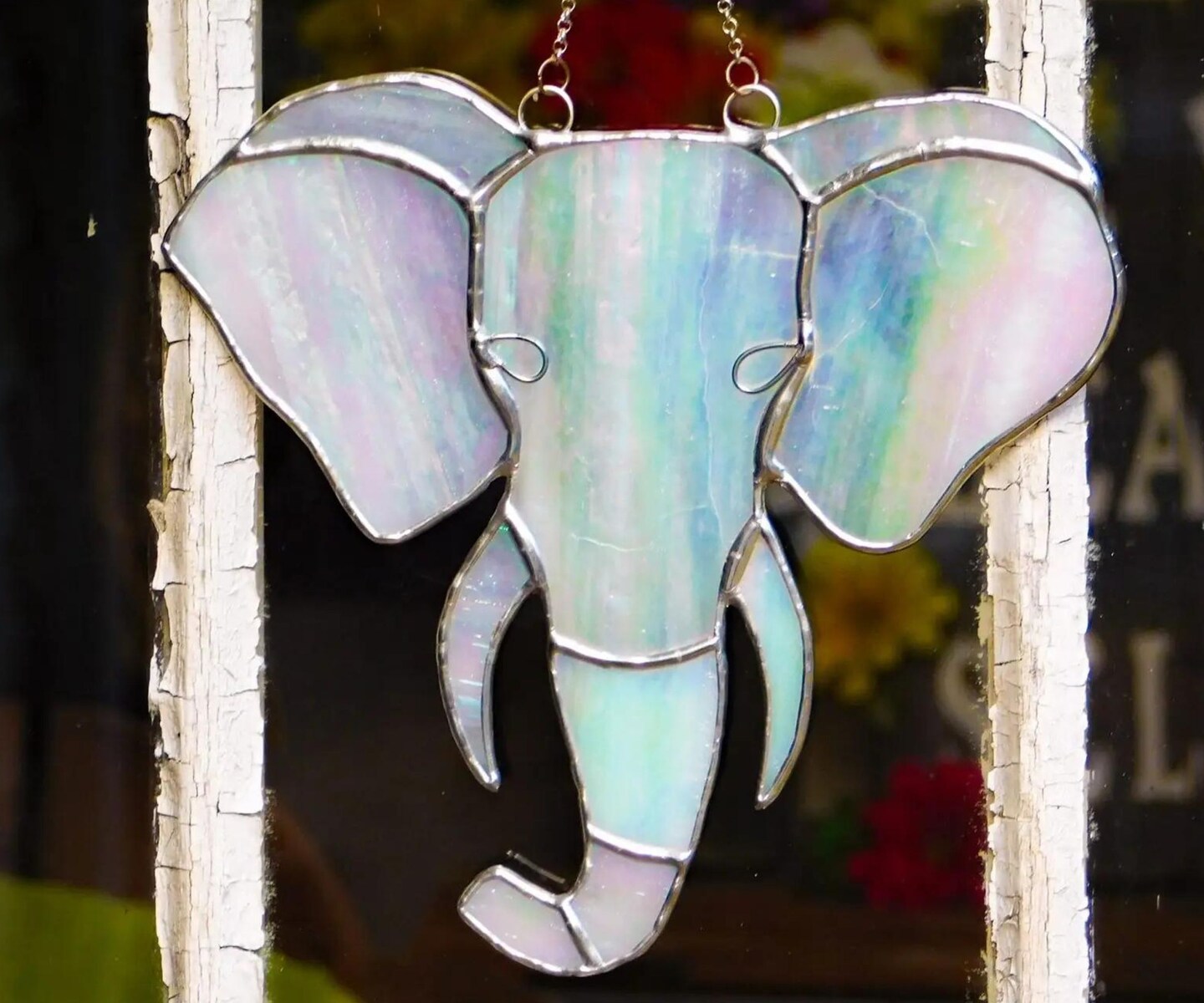 Stained orders glass elephant sun catcher. Smaller than a normal elephant this 6.5 x 9in creature is a perfect gift for that animal lover!