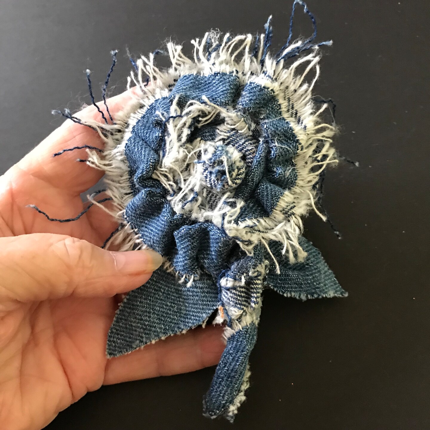 Handmade blue denim flower lapel pins 100 percent recycled denim