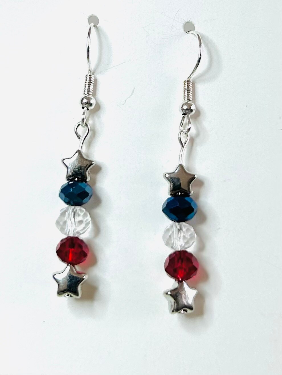 Red, white, and blue earrings with two stars