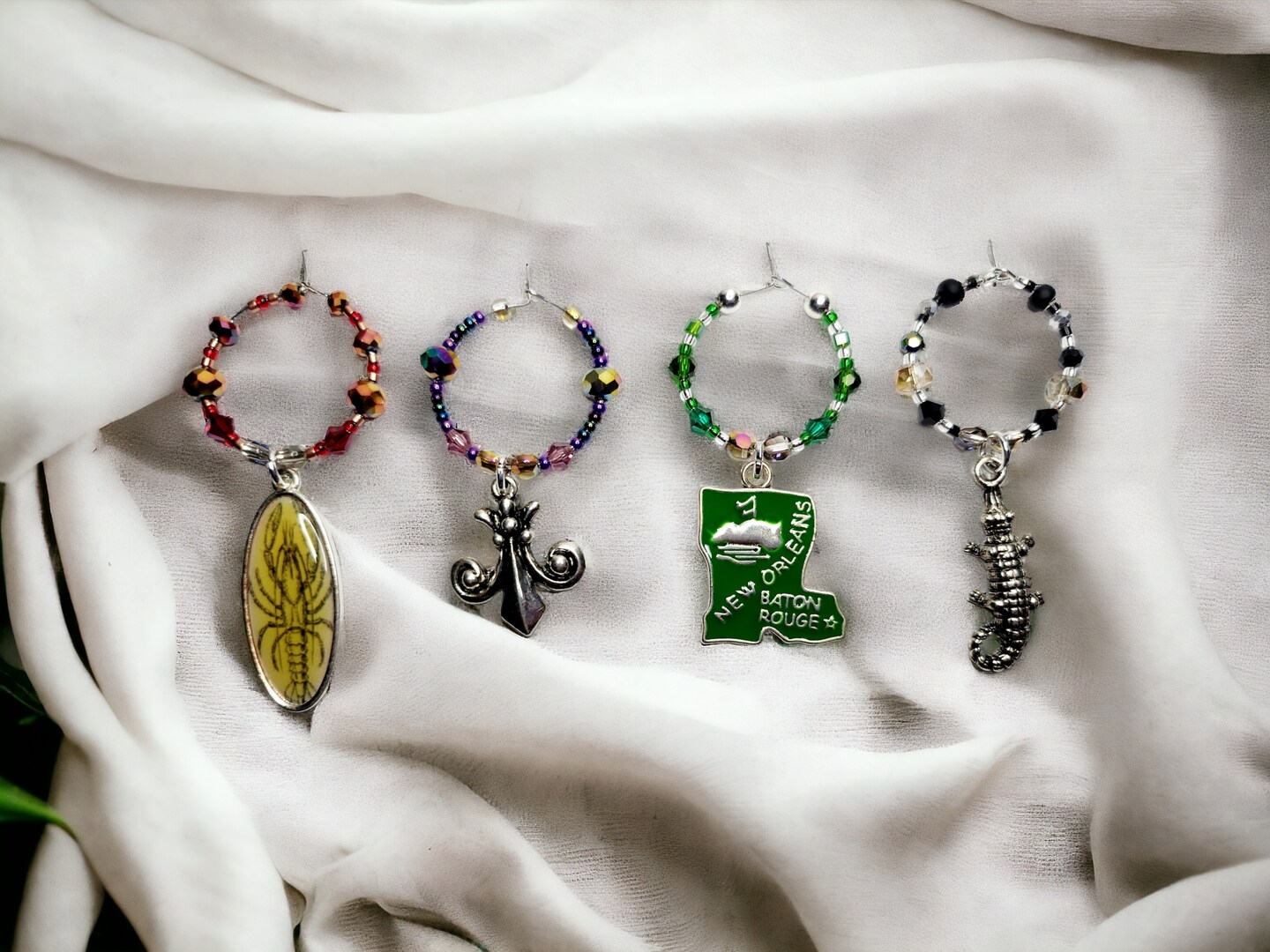 Louisiana themed enamel wine glass charms, each charm has its character,  color and accents beads. Handmade wine charms. | MakerPlace by Michaels